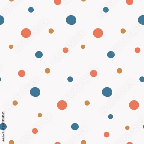 simple seamless pattern with bright multicolored random polka dot