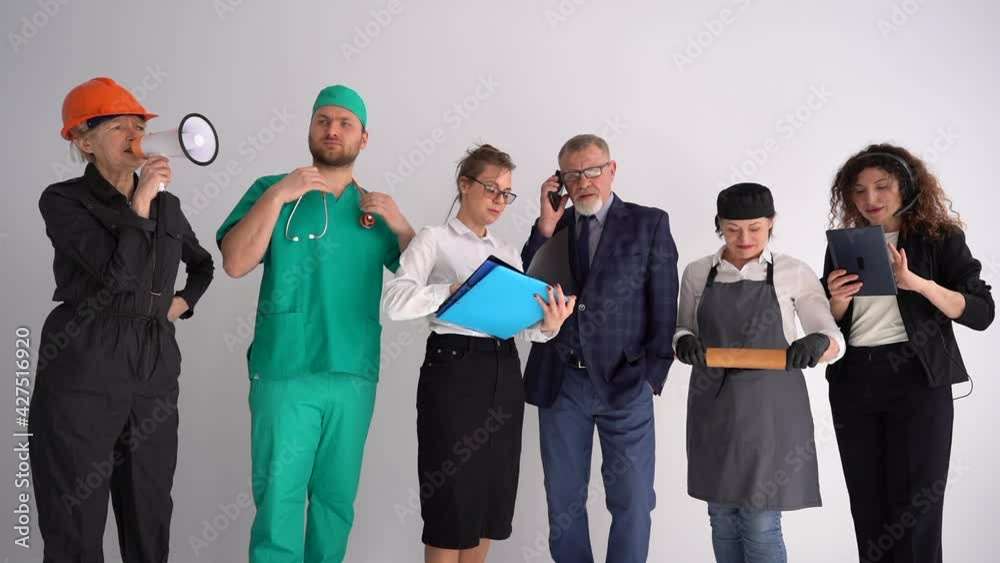 Six people in uniforms of different professions. Labor day concept