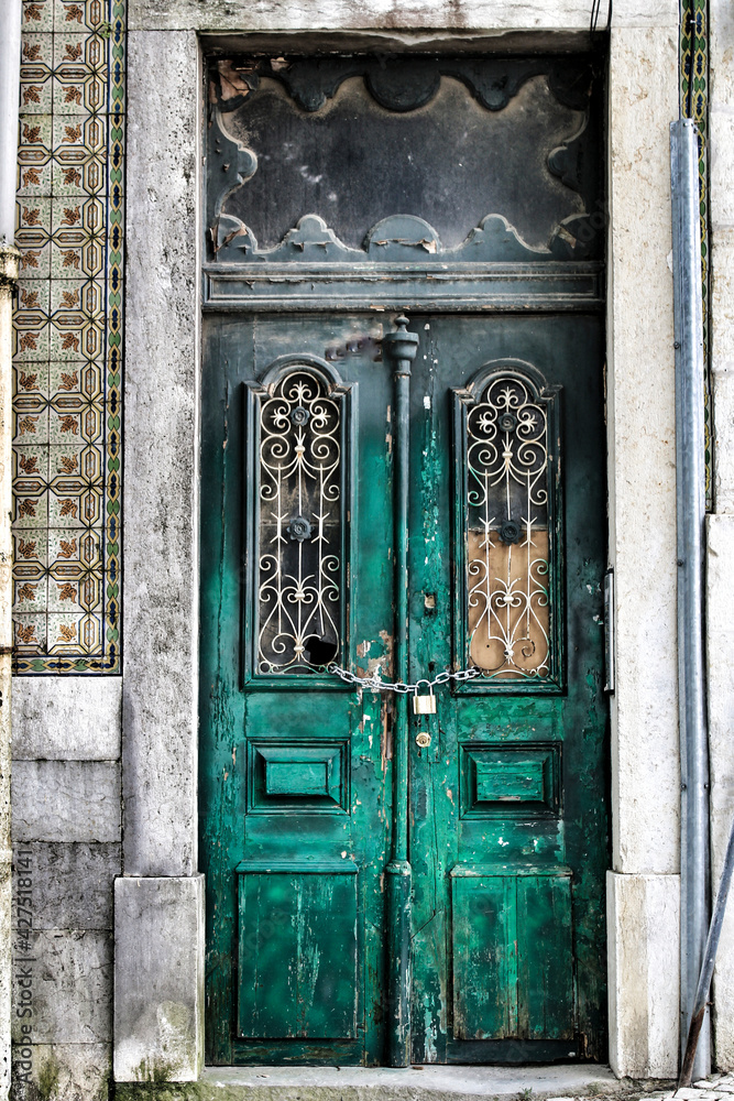 Old and colorful wooden door with iron details