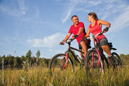 mature couple riding bicycle