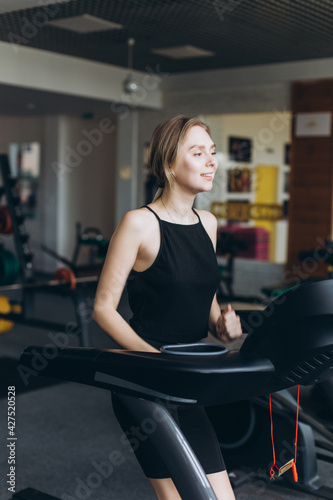 Girl doing exercise in the gym. Sport, healthy lifestyle concept