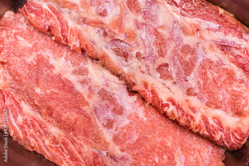 Raw red meat ambassador, pork neck background, close-up