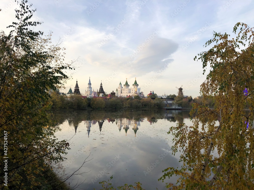 mill and farmstead on the background of the river