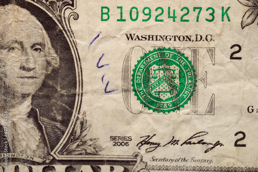 Fototapeta premium An old shabby notebook in one American dollar