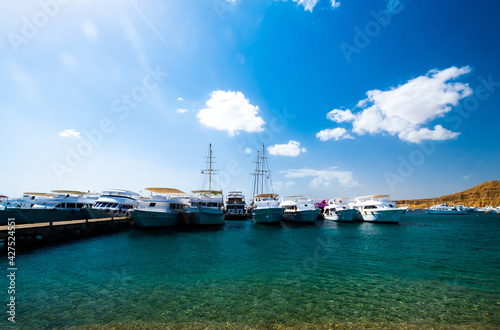 Beatiful view on naval harbor with white ships photo