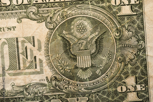 Closeup of a bird symbol on the dollar