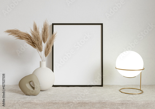 Single 8x10 Vertical Black Frame mockup on a textile cover with dry plant in vase and desktop light. 3D Rendering