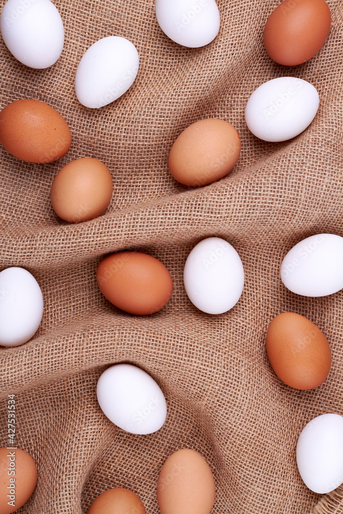Chicken eggs on a jute sack. Chicken eggs on a jute sack.