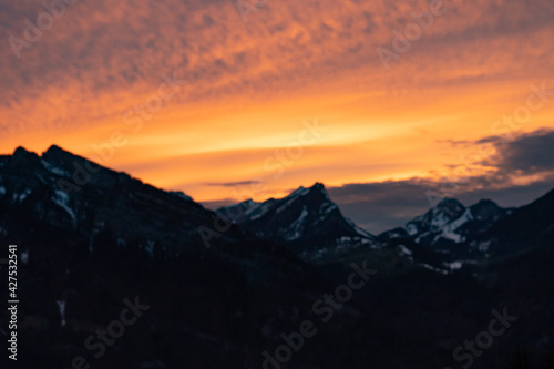 colorful sunset with mountains in swiss alps