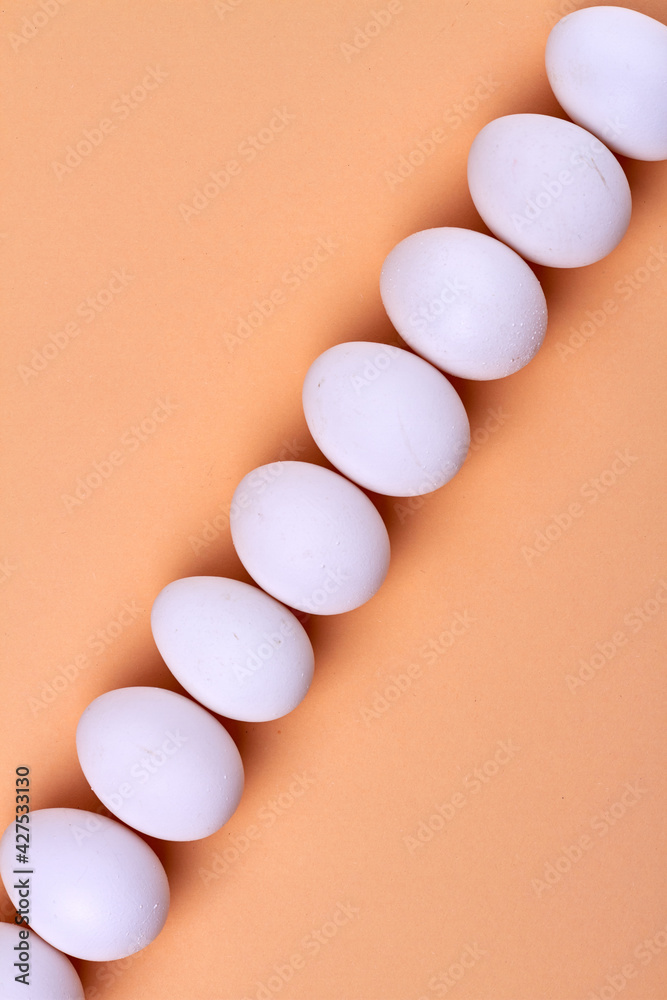 Diagonal line made ow white hen eggs.