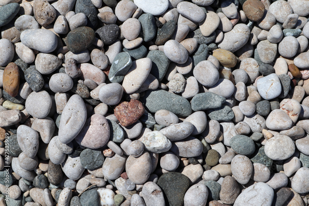Colorful large pebbles on the beach of mediterranean sea closeup Colorful large pebbles on the beach of mediterranean sea closeup