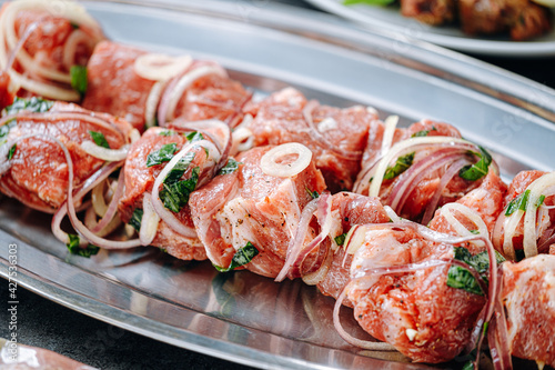 marinated meat for barbecue. Meat skewered and ready to grill