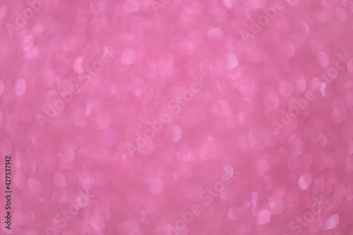 Festive blurred pink background with numerous bokeh, with place for text. Holidays concept, Valentine's Day, Happy Birthday, Baby Shower Day. For social media. Horizontal