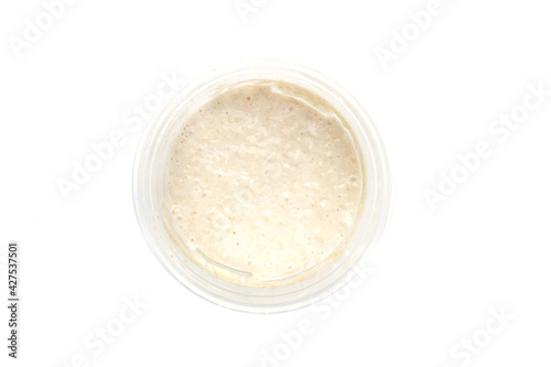 Top view of sourdough starter isolated on white background.
