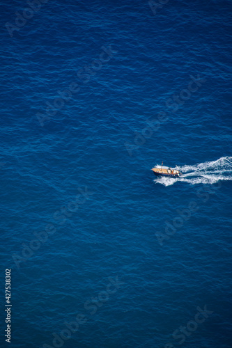 Beautiful view to boat in blue Mediterranean in Ravello, Amalfi coast, Italy in summer. © Zane