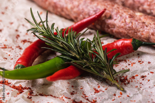 lyulya kebab close-up, meat dish for cooking in nature, barbecue lies on parchment light paper with spices and salt. Selective focus photo