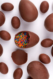 Chocolate egg with colorful sprinkles.
