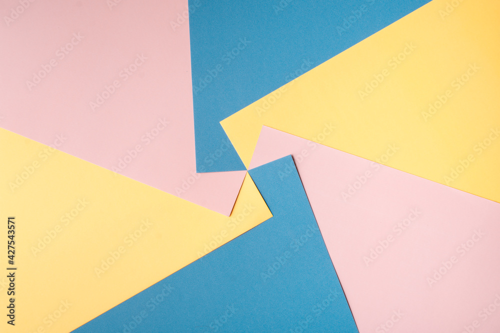 Colored papers in an abstract background Colored papers in an abstract background