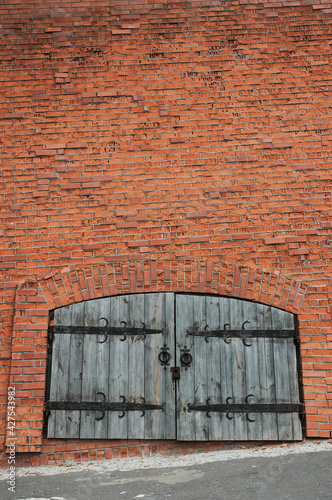 Gate in the red brick wall