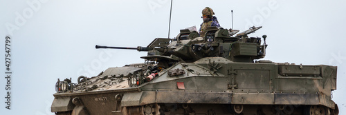 panoramic view of a british army FV510 warrior light infantry fighting vehicle tank on maneuvers on Salisbury Plain military training grounds, Wiltshire