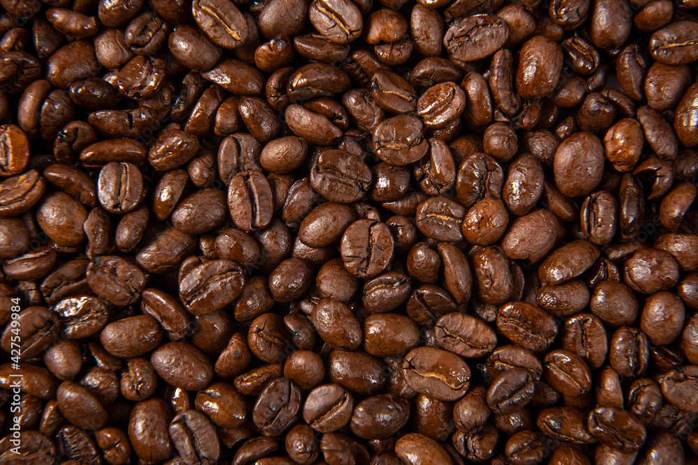 Freshly roasted coffee beans background. close up. Freshly roasted coffee beans background. close up.