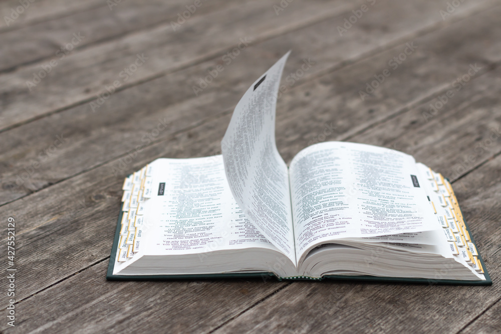 Fototapeta premium Open bible on rustic weathered wood