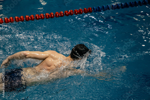 swimmer in swim meet doing sport