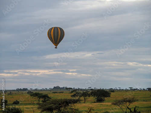Serengeti National Park, Tanzania, Africa - February 29, 2020: Hot air balloon rising above the Savannah, Serengeti National Park