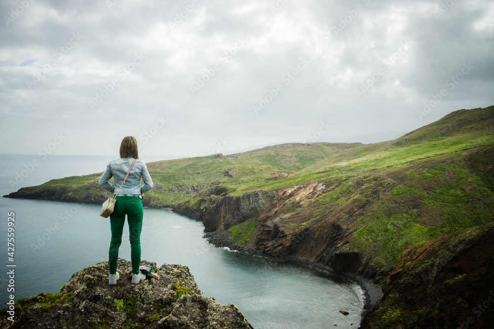 Woman enjoying the view at São Lourenço Cape in Madeira Island - Portugal