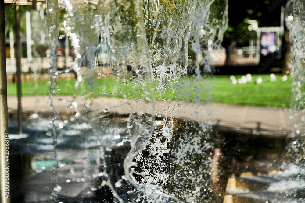 Fototapeta premium Abstract Water Falling From Various Shaped Nozzle's, In A Large Water Feature.