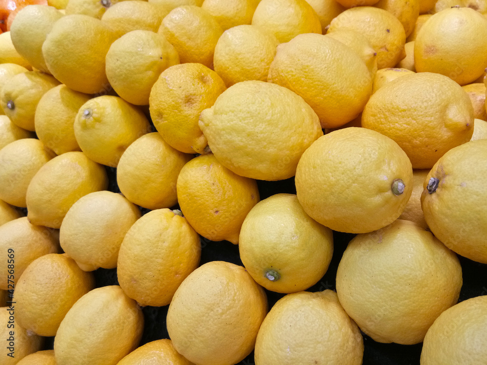 Stack of Lemon fruit being displayed on fresh fruit market Stack of Lemon fruit being displayed on fresh fruit market