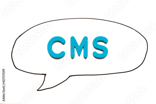 Alphabet letter with word CMS (Abbreviation of Content management system) in black line hand drawing as bubble speech on white board background