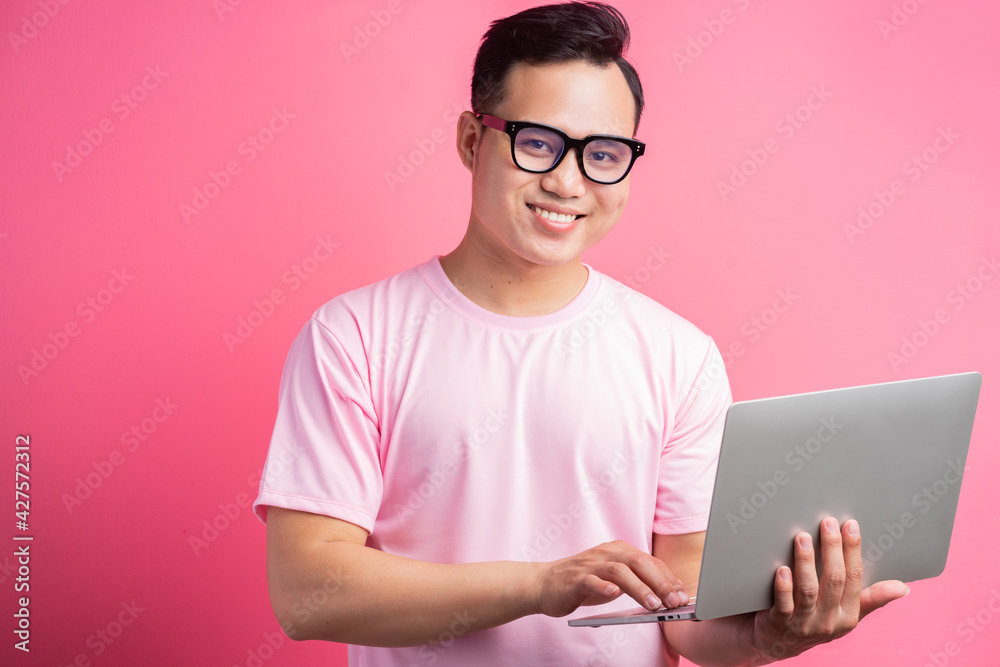 Asian man is using a laptop Asian man is using a laptop