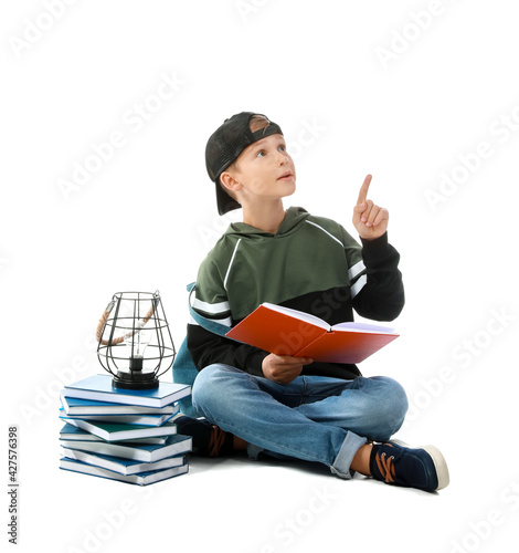 Cute little boy with books ...
