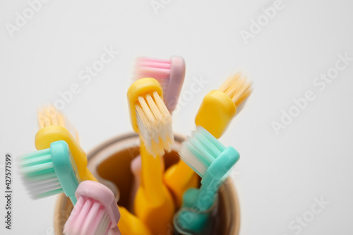 Holder with tooth brushes on white background  closeup