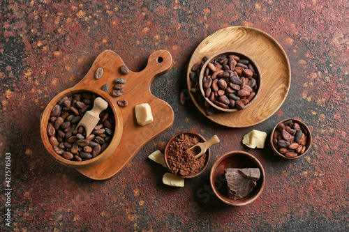 Composition with cocoa beans on grunge background
