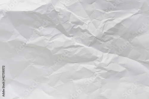 White crumpled paper texture background.