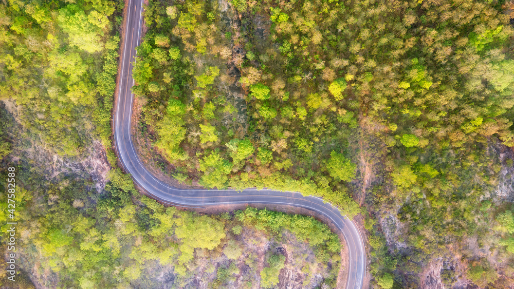 Winding road through the mountain pass, Aerial view by drone. Winding road through the mountain pass, Aerial view by drone.