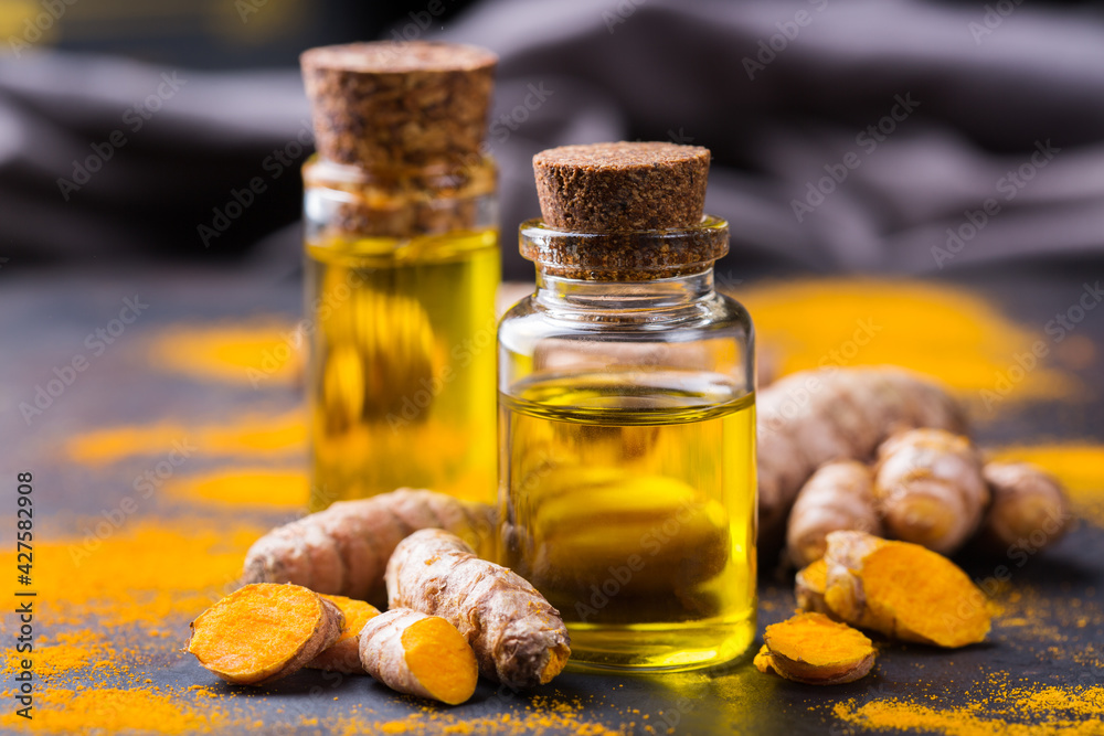 Turmeric essential oil, orange root and powder, beauty and spa Turmeric essential oil, orange root and powder, beauty and spa