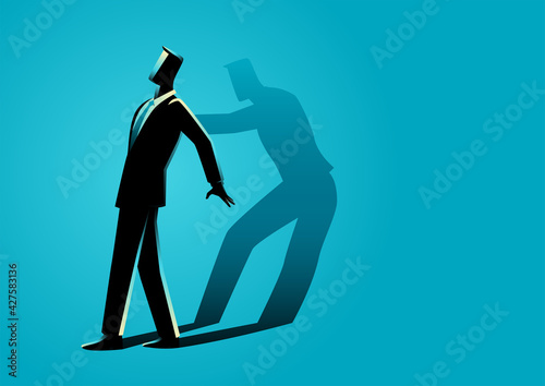 Businessman being pushed by his own shadow фототапет
