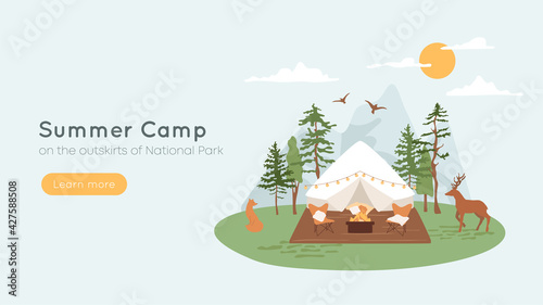 Bell tent with terrace, fire pit and lounge chairs. Concept of summer camp, glamping in forest. Mountains on background, wild animals fox and deer walking in parkland. Vacation, recreation banner.