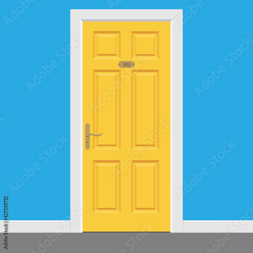 Yellow closed door with frame inside hotel room.