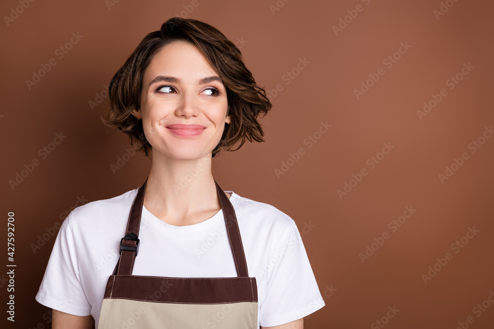 Photo of charming satisfied person smile look interested empty space isolated on brown color background