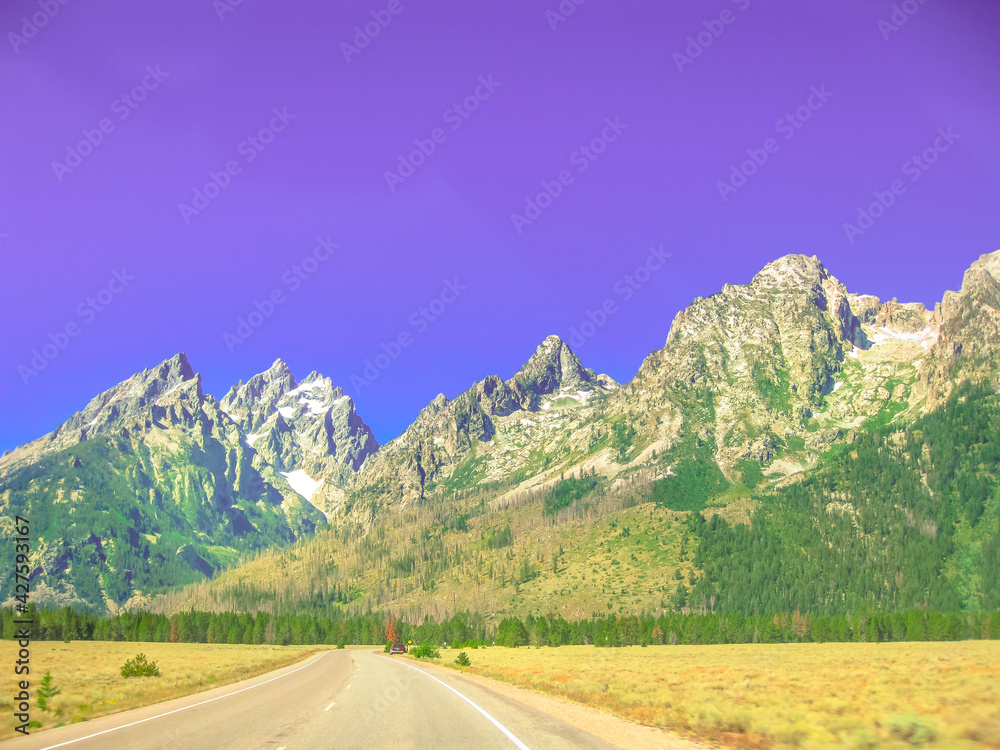 Naklejka premium A road trip along highway 191 the scenic main panoramic road at Grand Teton National Park, Wyoming, United States. Sunset light shot.