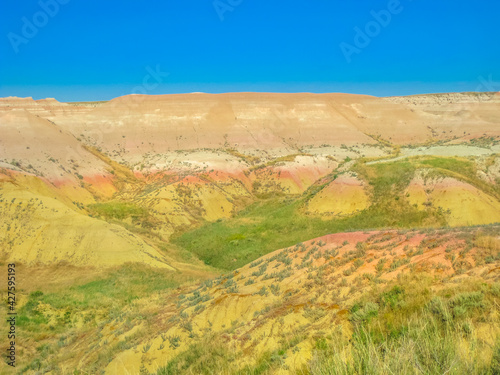 Yellow Mounds Overlook along Loop Road in Badlands National Park, South Dakota, United States. Summer season. Blue sky with copy space.