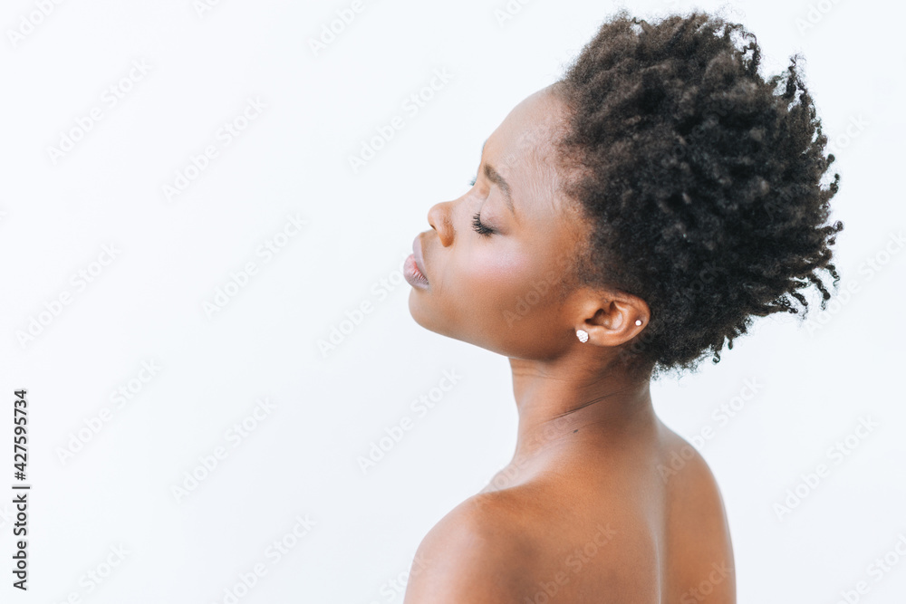 Beauty portrait of beautiful young African American woman in black top isolated on white background