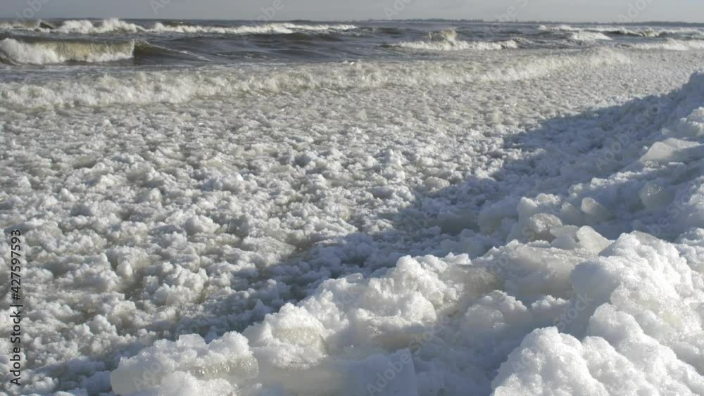Ice floes and Icebergs on Frozen Baltic Sea in Poland on Sunny Day Ice floes and Icebergs on Frozen Baltic Sea in Poland on Sunny Day