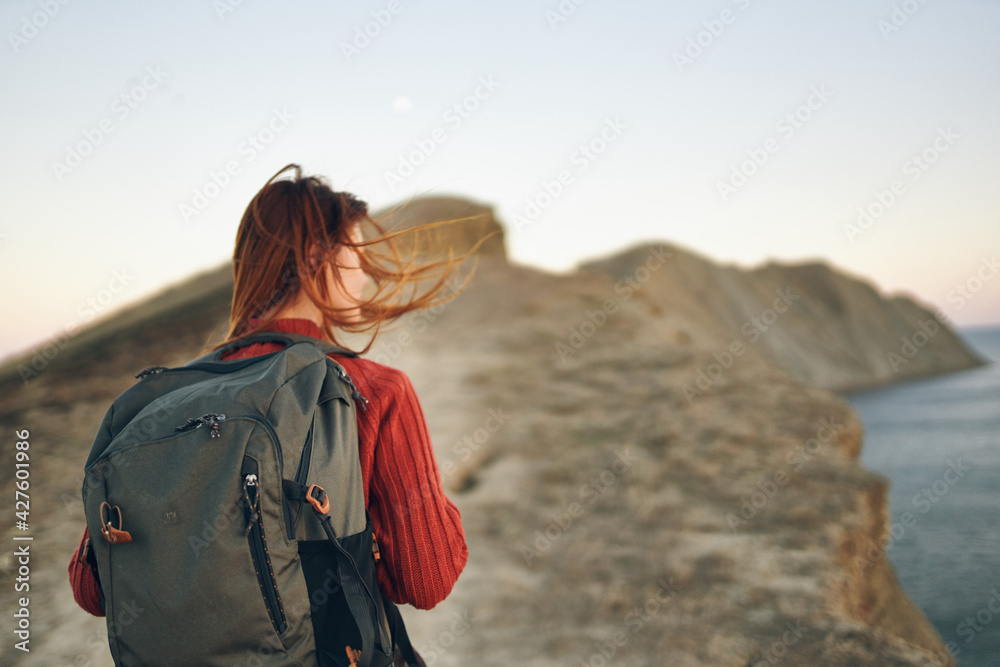 woman travels in the mountains outdoors adventure sea fresh air sunset landscape