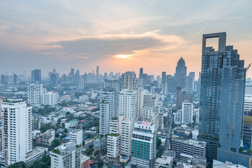 Obraz premium Bangkok Cityscape Business Administrative center view from rooftop during sunset. Picture taken on Feb 28, 2021