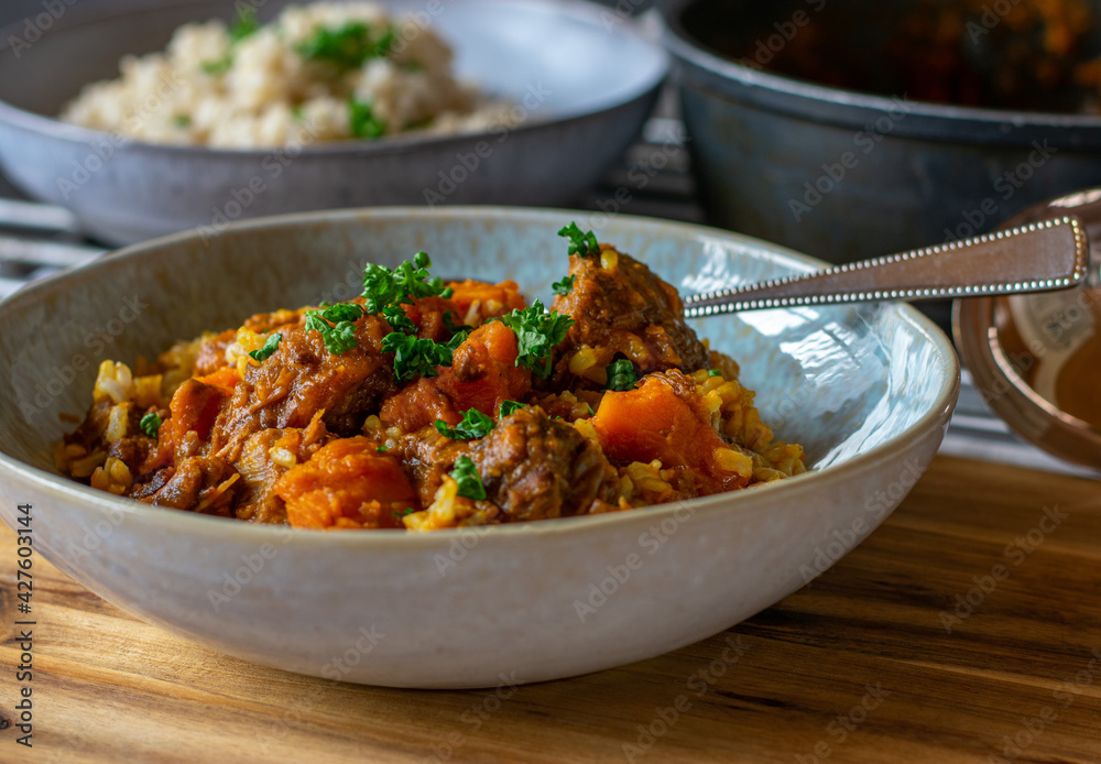 Delicious beef stew with brown rice and carrots Delicious beef stew with brown rice and carrots